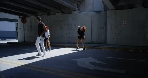 Dancers performing their routine under an overpass Stock Footage 97446811