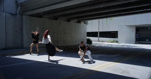 Dancers performing their routine under an overpass Stock Footage 97447587