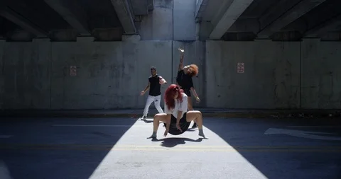 Dancers performing their routine under an overpass Stock Footage 97448013
