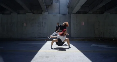 Dancers performing their routine under an overpass Stock Footage 97451888