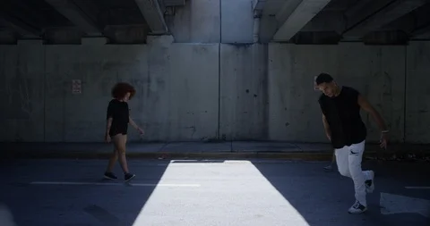Dancers performing their routine under an overpass Stock Footage 97501506