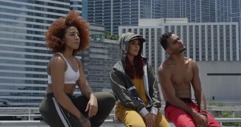 Dancers posing against a cityscape Stock Footage 97242658