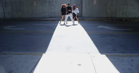 Dancers posing under an overpass Stock Footage 97034875