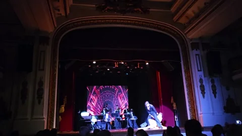 Dancers Before Zigzag Light Screen on Theater Stage, Tango, Argentina 8K Video stock 306465208