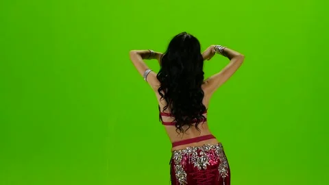 Dances belly dancing her movements are unique . Green screen. Slow motion Stock Footage 105032429