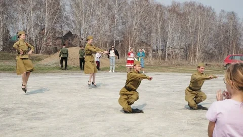 Dances. Young dancers in the uniform of the Second World War dance a dance. Stock-Footage 240835425