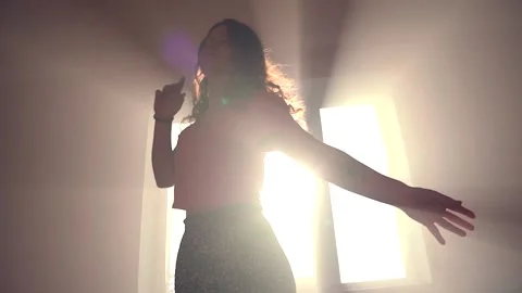 Dancing against sun beams in slowmotion Stock Footage 170193452