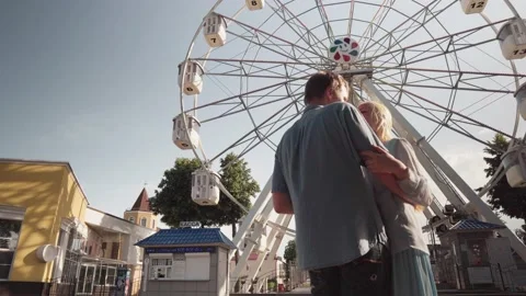 Dancing on the background of a ferris wheel. Stock Footage 133312978