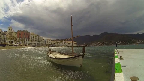 Dancing boat in a windy Day at Sant Pere Pescador beach Video stock 103370034