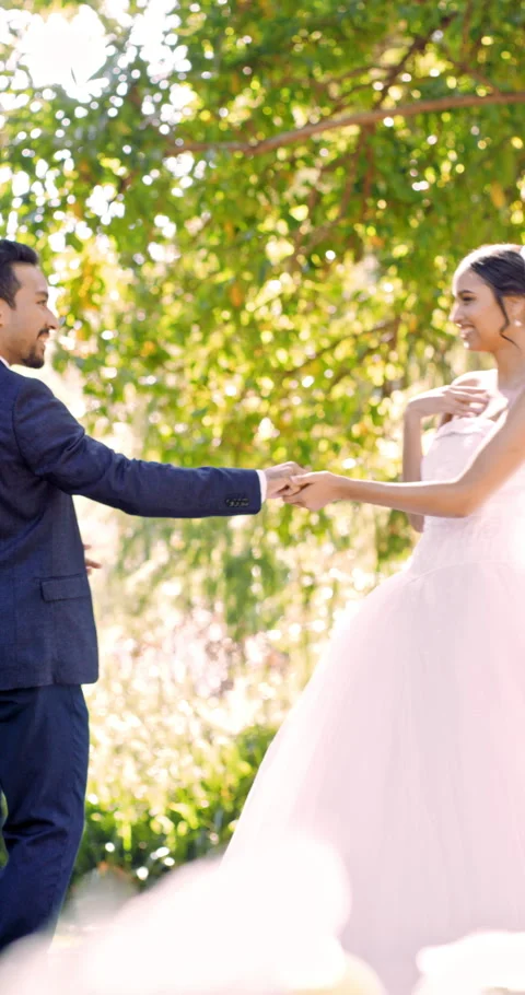 Dancing, bride and groom with smile in park, marriage commitment and wedding Stock Footage 336695768