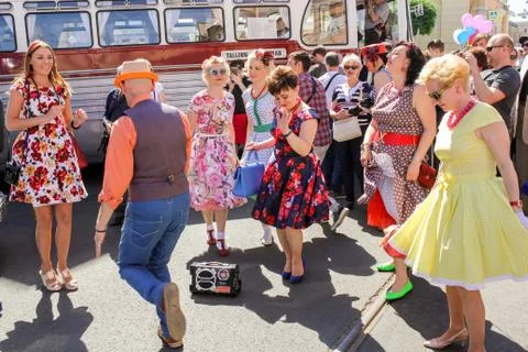 Dancing by the bus. Stock Photos