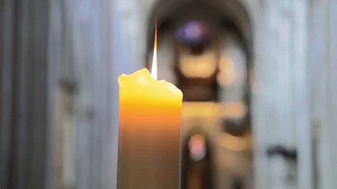 Dancing candle flame in a Cathedral Stock Footage 79924086