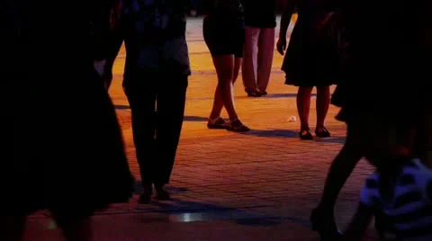 Dancing Chinese people crowd in the square at night. Stock Footage 12749060