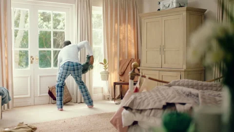 Dancing, chores and black man in home with energy for celebration, performance 스톡 동영상 335828106