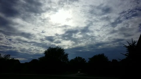 Dancing clouds from day to night with moving cars and headlights timelapse Stock Footage 94132120