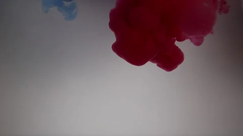 Dancing Colors: Red and Blue Ink Swirling in Water Stock Footage 270685006