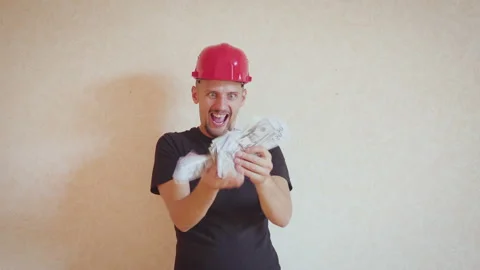 Dancing construction worker with money and construction helmet. concept of 스톡 동영상 142719844