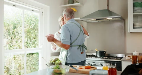 Dancing, cooking and senior couple in home kitchen with energy, bonding and love Stock Footage 341104746