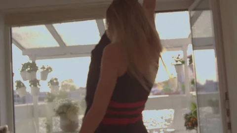 Dancing couple in front of balcony  Video stock 111256456