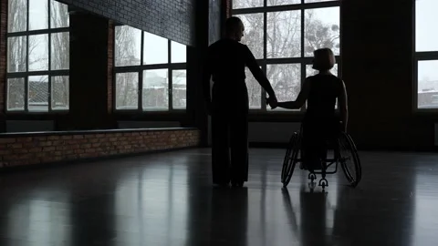 Dancing couple holding hands standing in ballroom Stock Footage 157919138