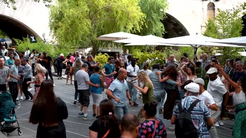 Dancing Couples at Public Paris Summer Festival: Romantic Atmosphere by Stock Footage 249155261
