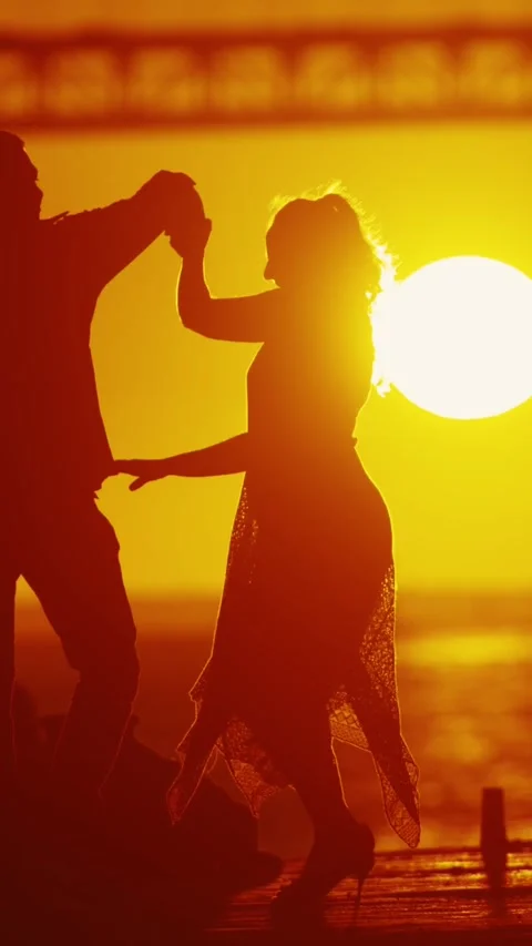 Dancing couples silhouette with setting sun. Stock Footage 330159176