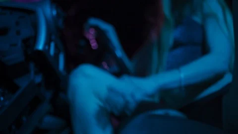 Dancing in a crossover car: Attractive long hair hot blonde girl in blue and Stock-Footage 122501176