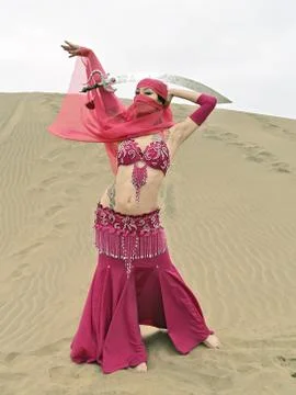 Dancing at desert with sabre Stock Photos
