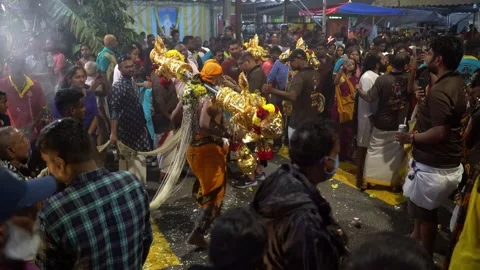 Dancing devotee with huge golden pole at the parade for Thaipusam festival .. Stock Footage 258137383