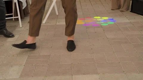 Dancing feet on the dance floor illuminated by spotlights Stock Footage 329093942