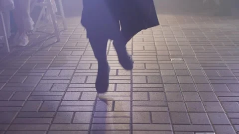 Dancing feet on the dance floor illuminated by spotlights Video stock 329249076