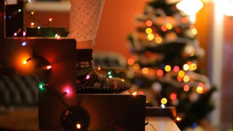 Dancing feet on glowing staircase on the background of the Christmas tree. Stock Footage 70738636