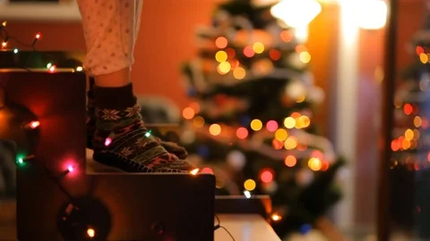 Dancing feet on glowing staircase on the background of the Christmas tree. Stock Footage 70738763