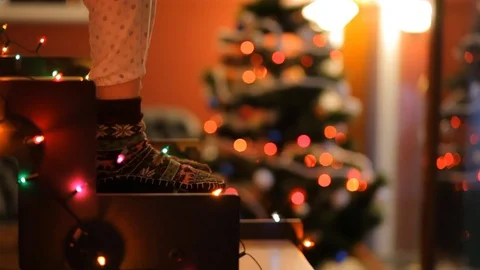 Dancing feet on glowing staircase on the background of the Christmas tree. Stock Footage 70738820