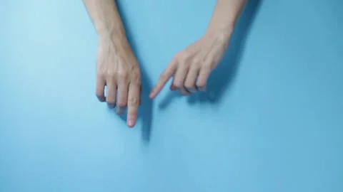 Dancing fingers on a blue background Stock Footage 160089803