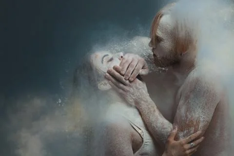Dancing in flour concept. Guy man male shuts mouth of girl woman female. Coup 写真素材