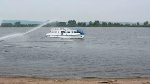 Dancing fountain attacks the ship with a stream of water. Water incident. Stock Footage 143442377