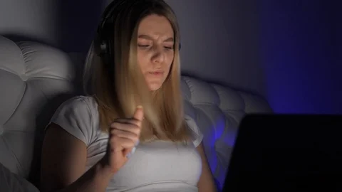 Dancing in front of a laptop Stock Footage 105897156