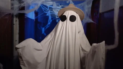 Dancing ghost in hat wear sheet in hallway cobwebs Stock Footage 313669045