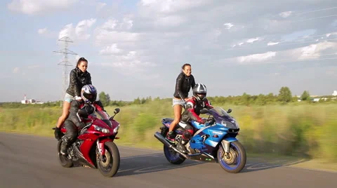Dancing girl on a motorcycle Stock Footage 42884704
