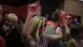 Dancing girl in strobe lights during night club party HD Footage