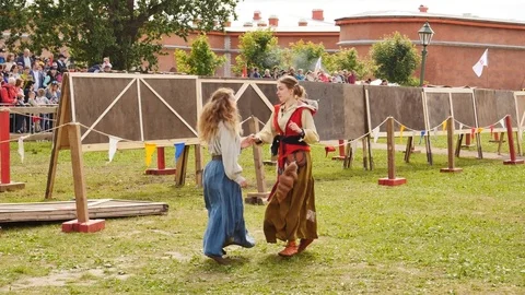 Dancing girls in medieval clothes Stock Footage 77889922
