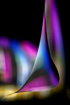 Dancing glowing multicolored patterns. Background, backdrop or wallpaper. Abs Stock Photos