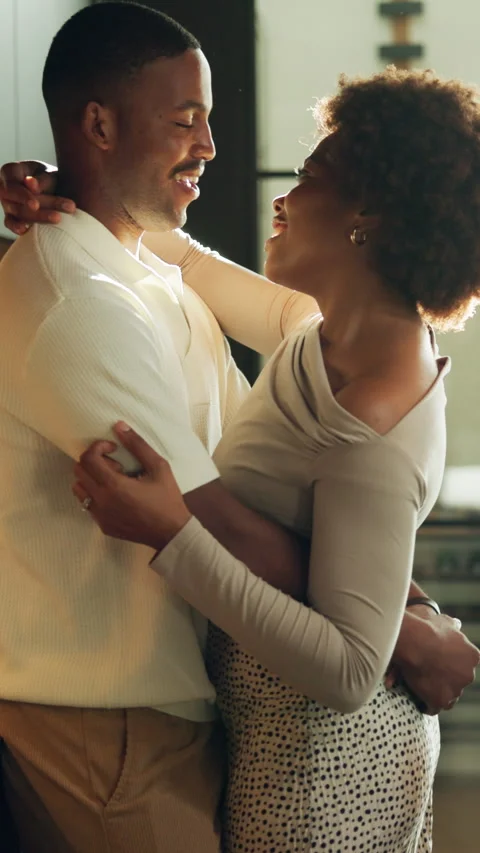 Dancing, happy and couple in kitchen with embrace for bonding, connection and Stock Footage 340780387