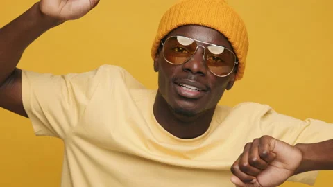 Dancing happy funny black African American man moving to music waving hands up Stock Footage 154004853