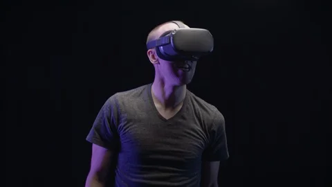 Dancing Happy Man Plays VR or Virtual Reality on Black Background Slow Motion 스톡 동영상 118598420