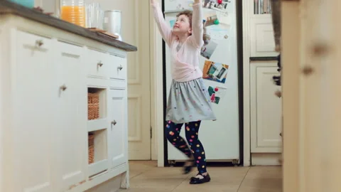 Dancing, home and child in kitchen with spinning, rhythm or creative performance Stock Footage 335802216