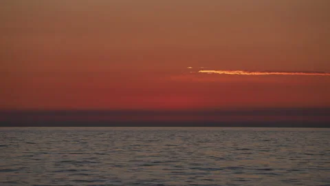 Dancing Horizons. Timelapse Serenity of the Setting Sun Over the Sea Stock Footage 267414586