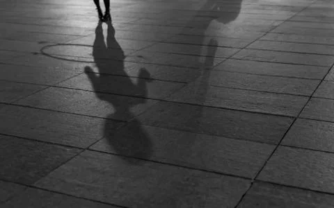 Dancing hula hoop shadow Stock Photos