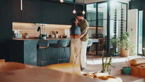 Dancing, kiss and couple in kitchen at house for bonding, connection or marriage Stock Footage 344257376